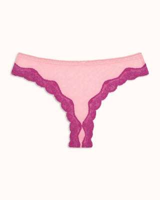 Pink lace panties with darker pink trim on a white background