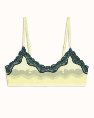 Yellow bra with green lace trim on a white background