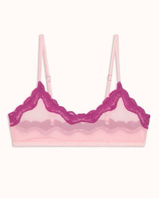 Pink bralette with lace details on a white background