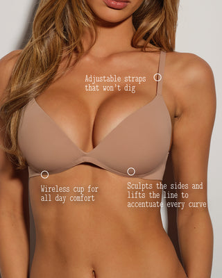 Beige bra worn by a model with text highlighting features on a plain background